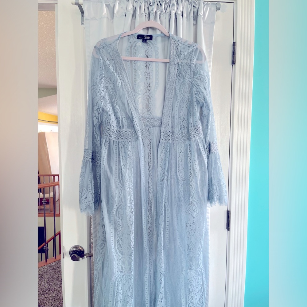Ladies lace cardigan/ wrap , light blue with waist area enhanced